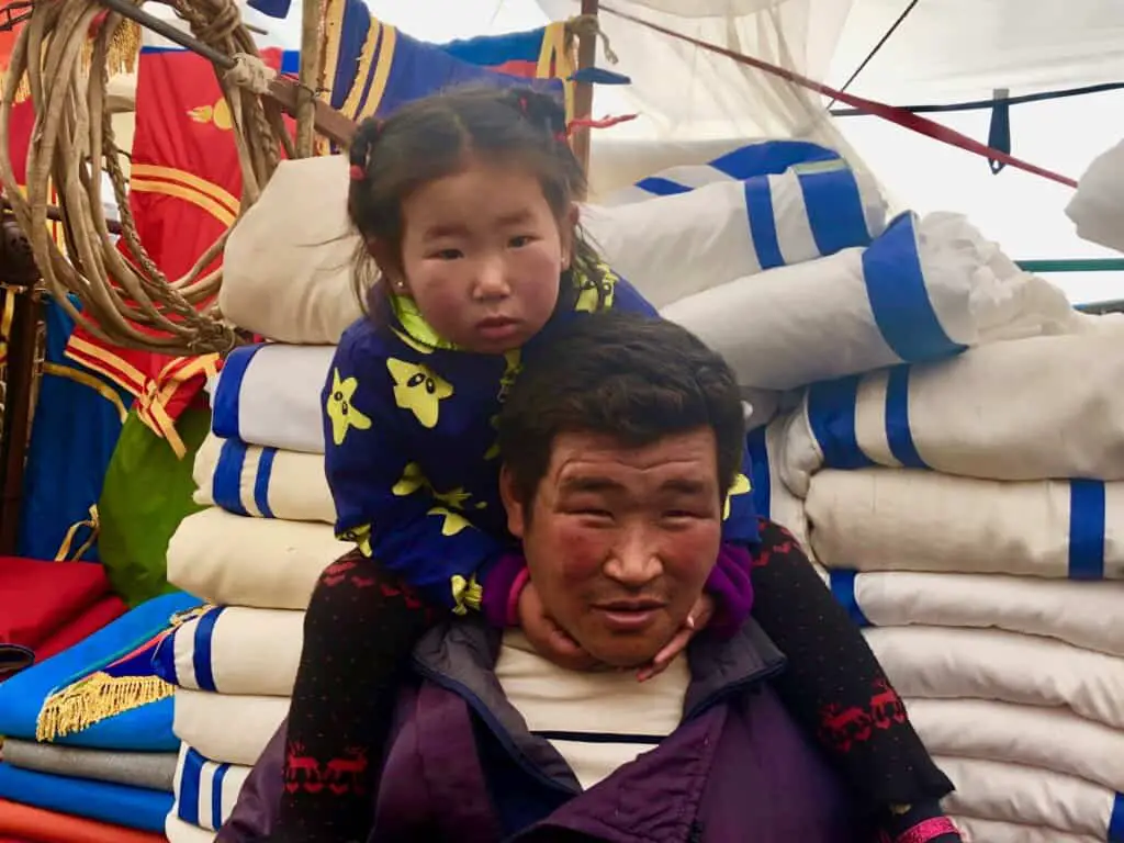 Nomadic herder and his daughter, Mongolia