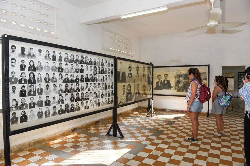 People at Tuoi Sleng Museum seeing the photos of victims