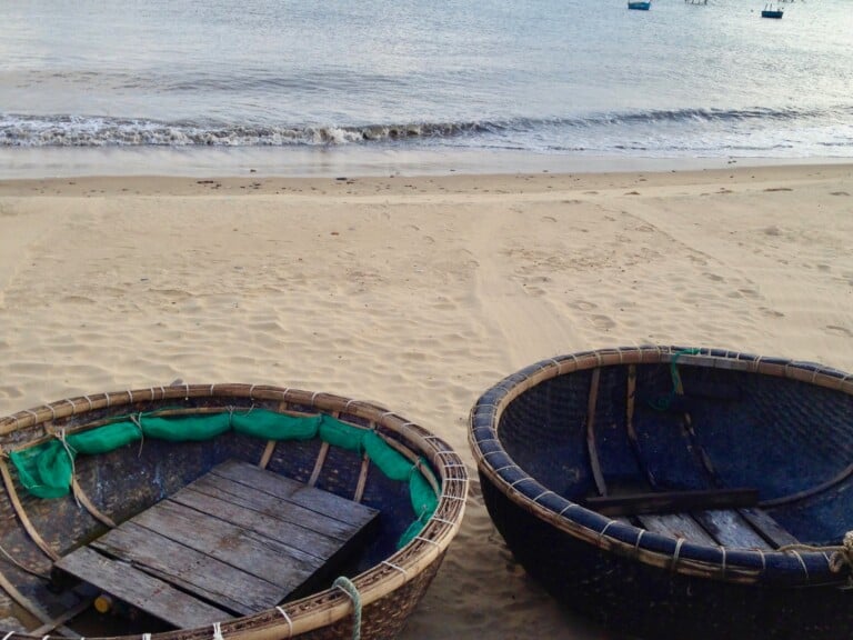 What Are the Round Basket Boats You See In Vietnam? - A Bus On a Dusty Road