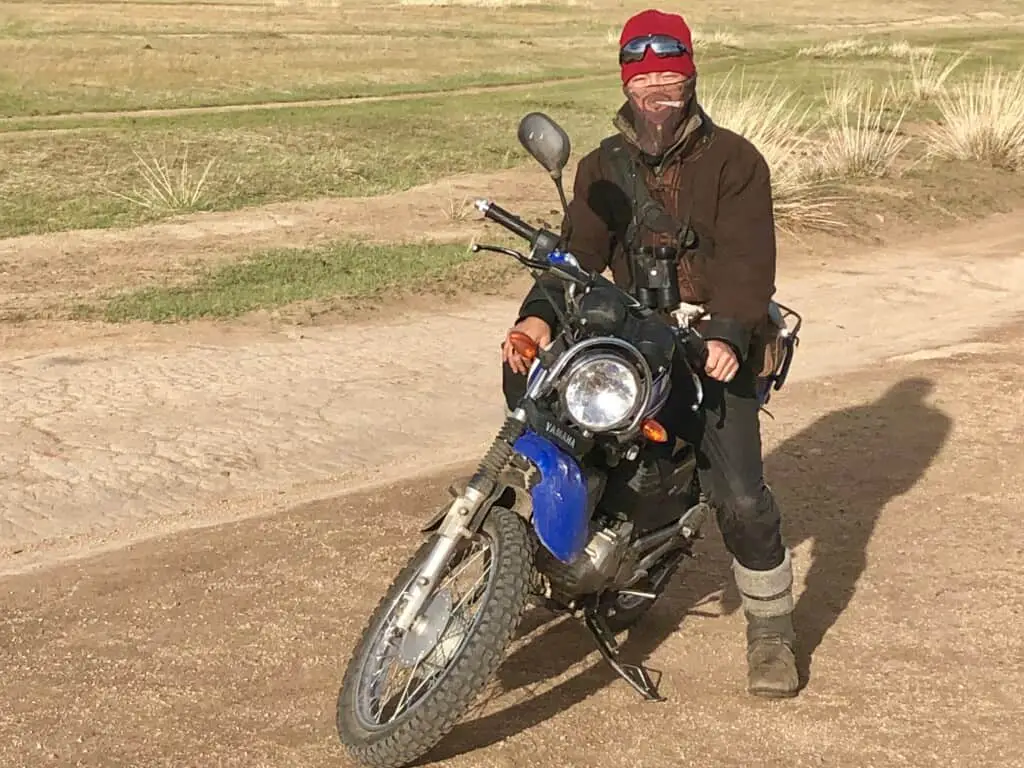 Nature Reserve Researcher on his dirt bike. he loaned us his binoculars.