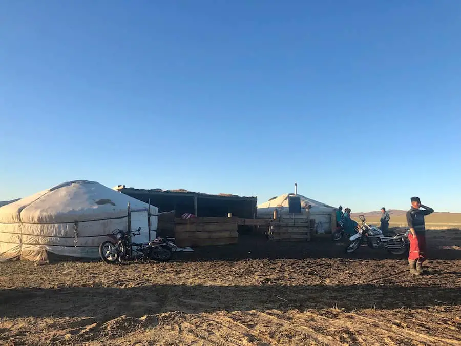 A nomadic campsite with dirt bikes, Mongolia.