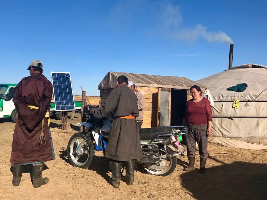 Nomads getting ready to ride their dirt bikes.