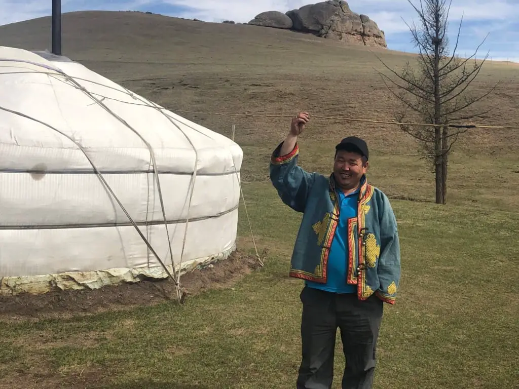 A Mongolia Herder Outside His Ger (Yurt)