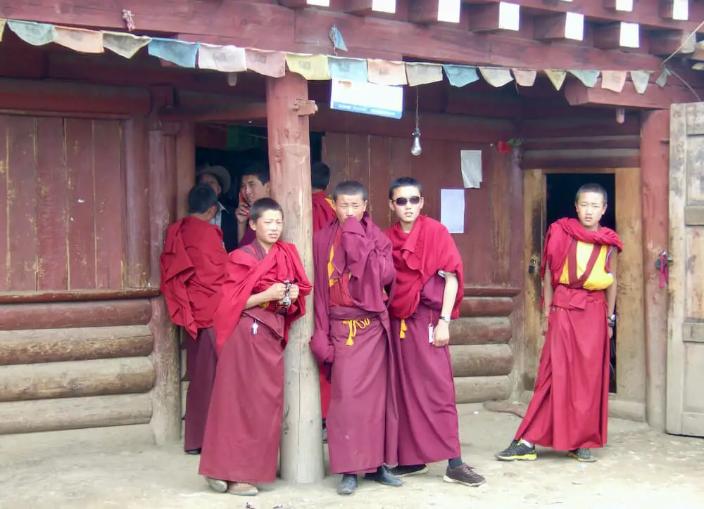 Tibetan Monks Outside a Temple