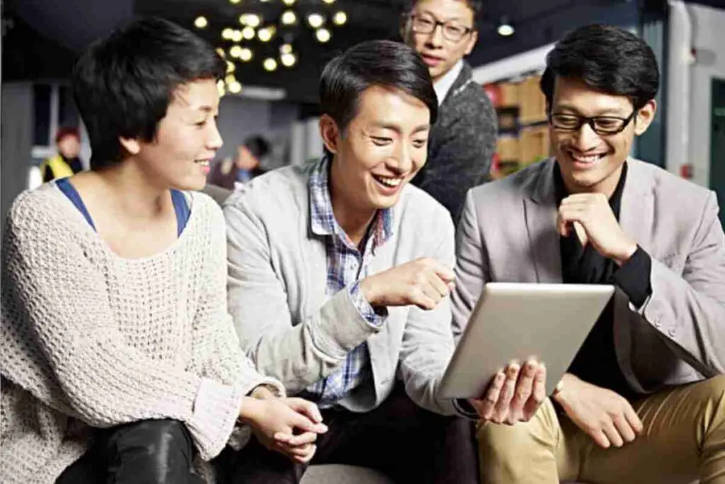 Chinese workers having a meeting