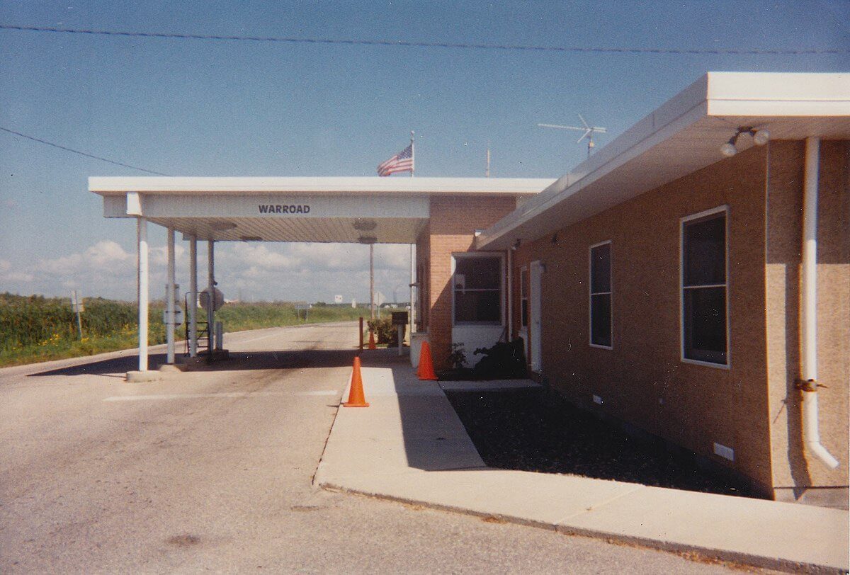 Does Wisconsin Border Canada? A Bus On a Dusty Road