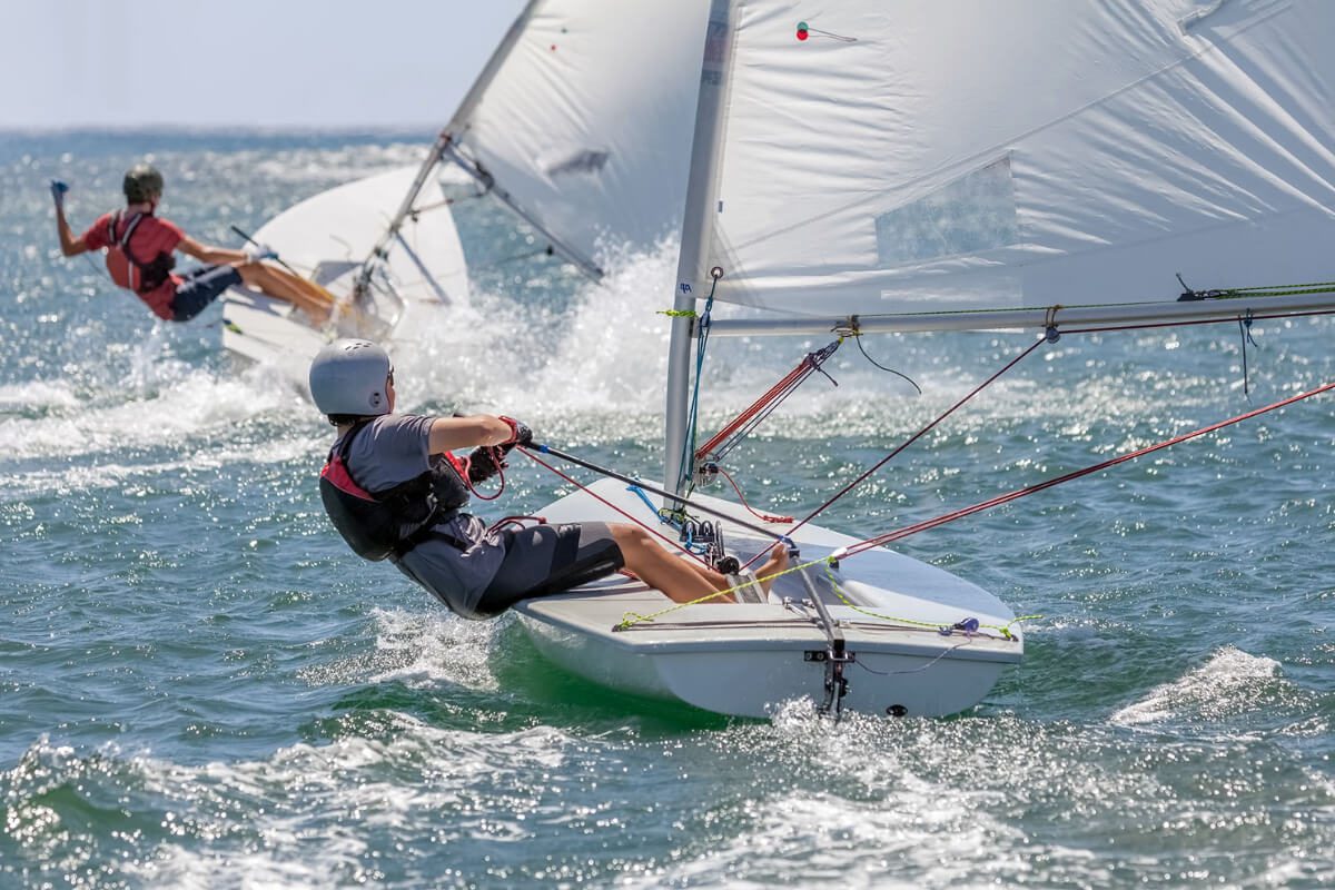 Keel Boat Vs. Dinghy Boat, Which One To Learn Sailing? A Bus On a