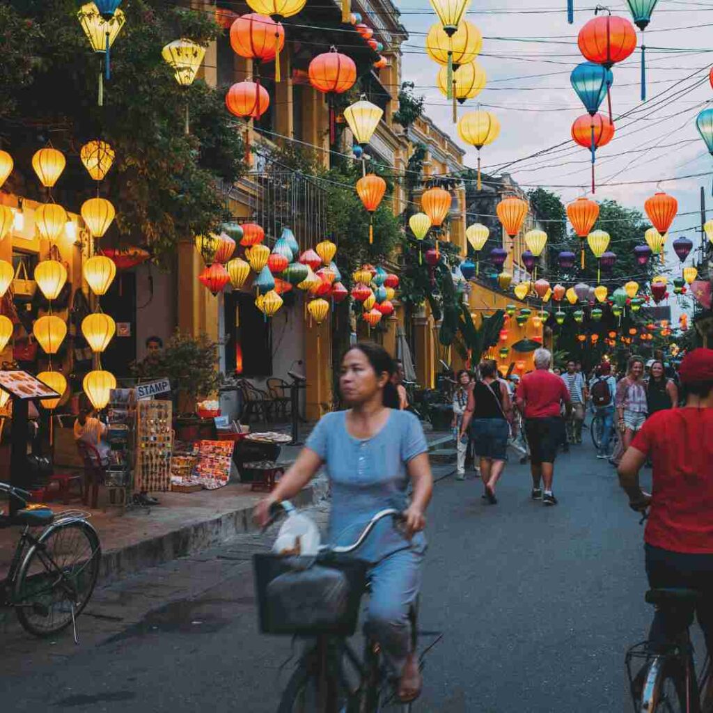 A vietnamese woman riding a bicycle
