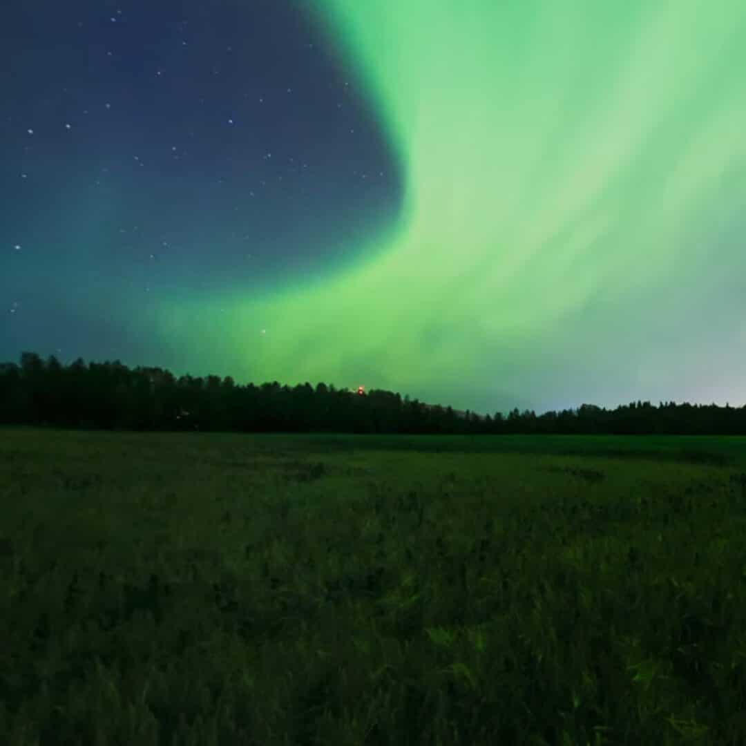 Guide To Where To See Northern Lights In The USA A Bus On a Dusty Road