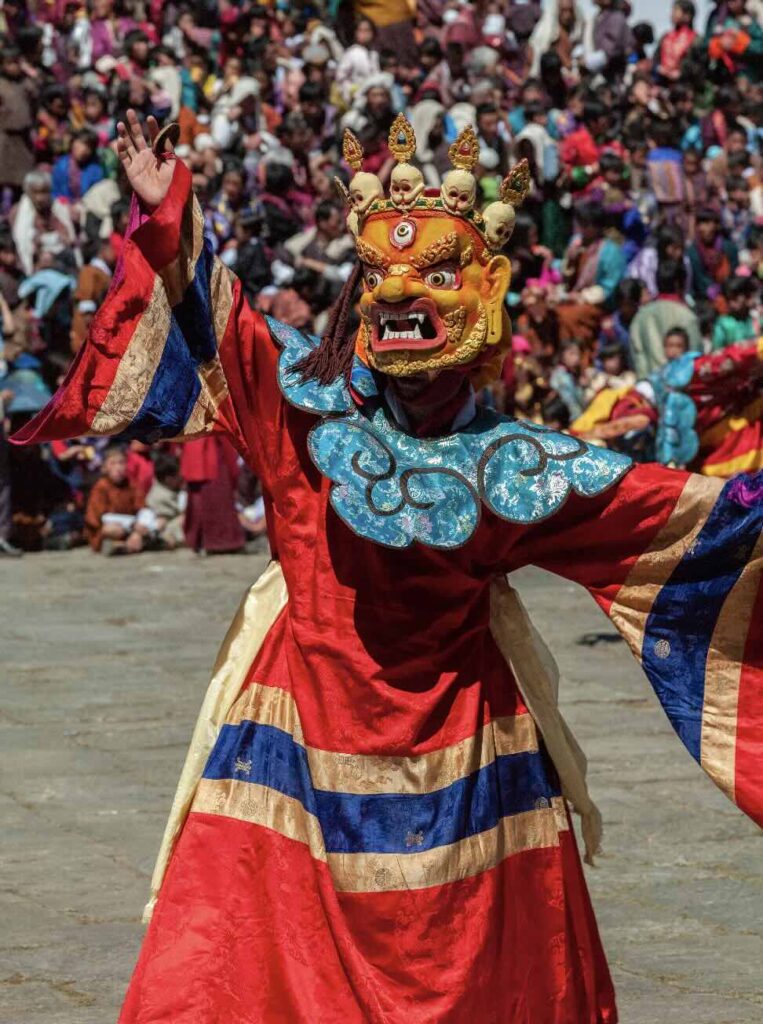 One of the performer in Bhutan, wearing a Dragon mask.