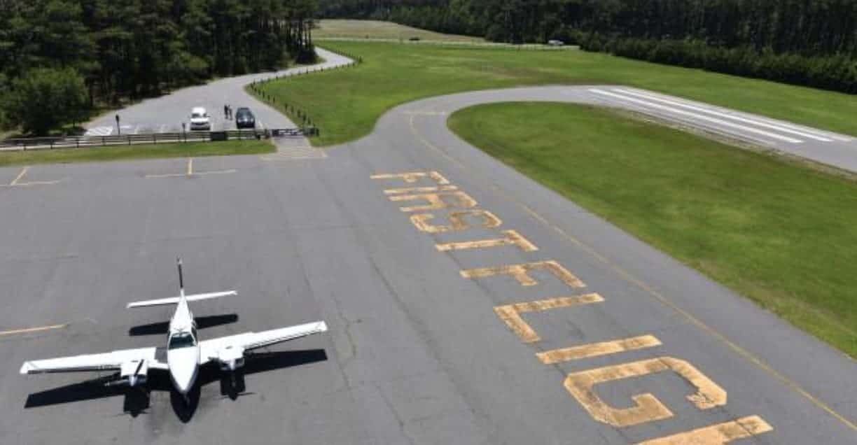 Fly to the Outer Banks Nearest Airports A Bus On a Dusty Road