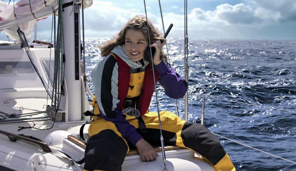 a woman in a life jacket on a boat