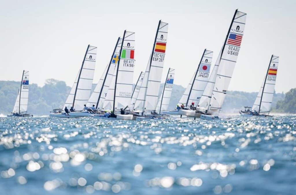 a group of sailboats on the water